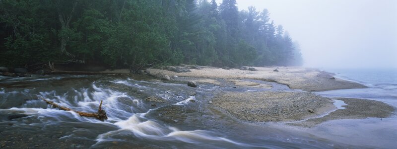 Foggy river meeting the sea