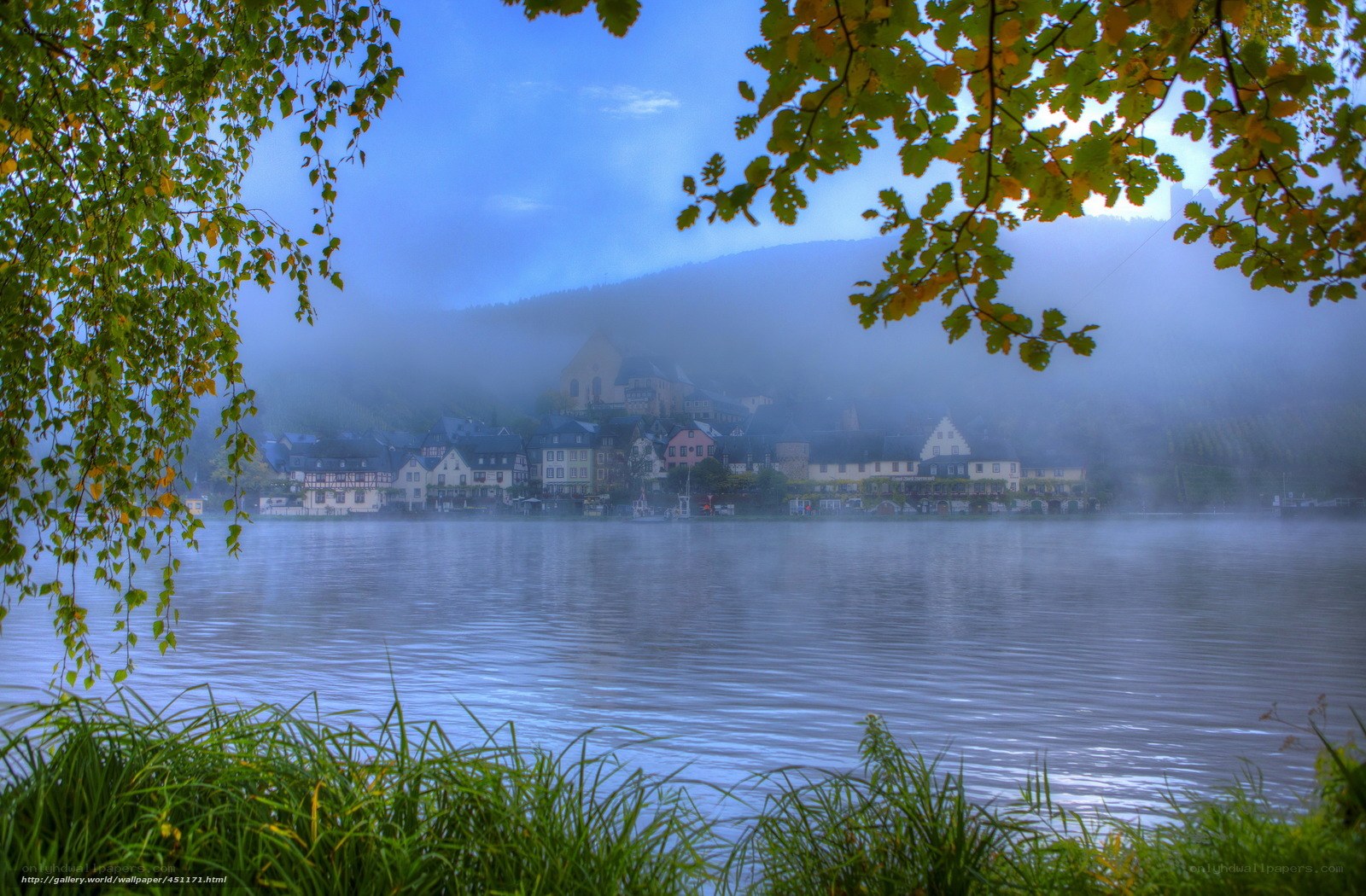 Foggy river town at dawn
