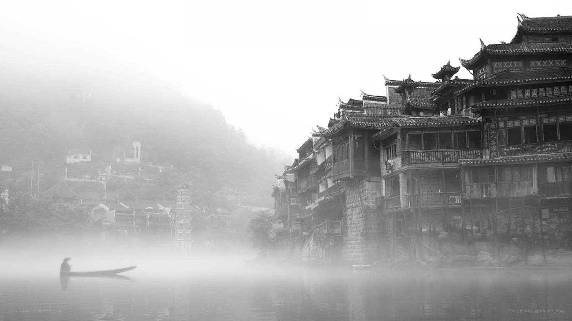 Foggy river village scene