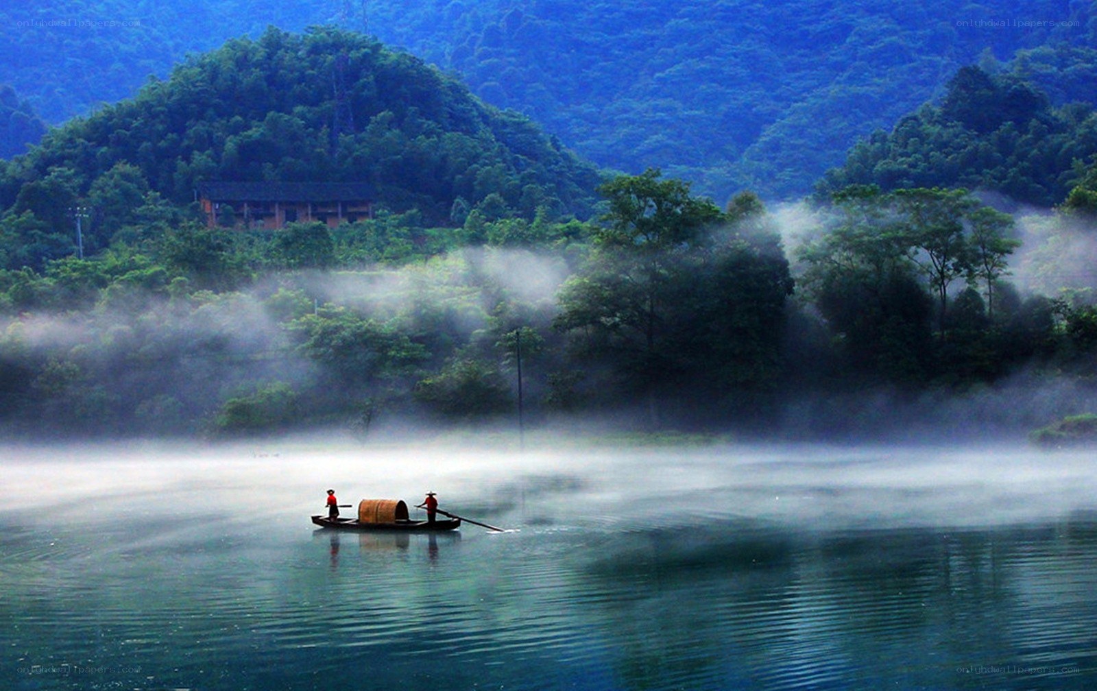 Foggy river with boat