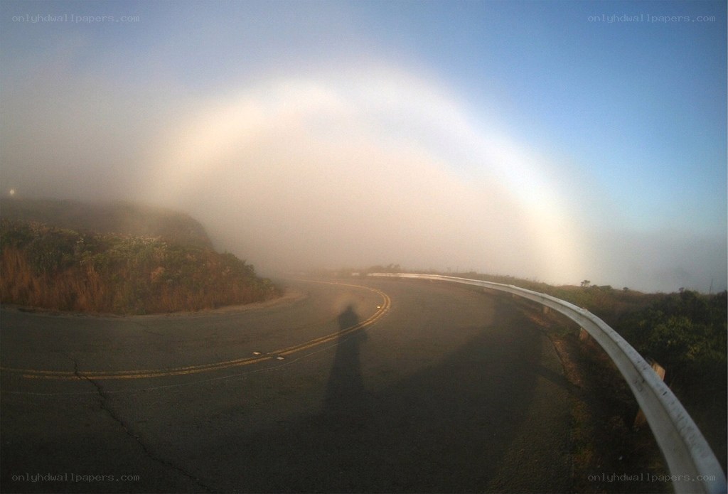 foggy road with rainbow