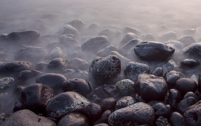 foggy rocks at the shoreline