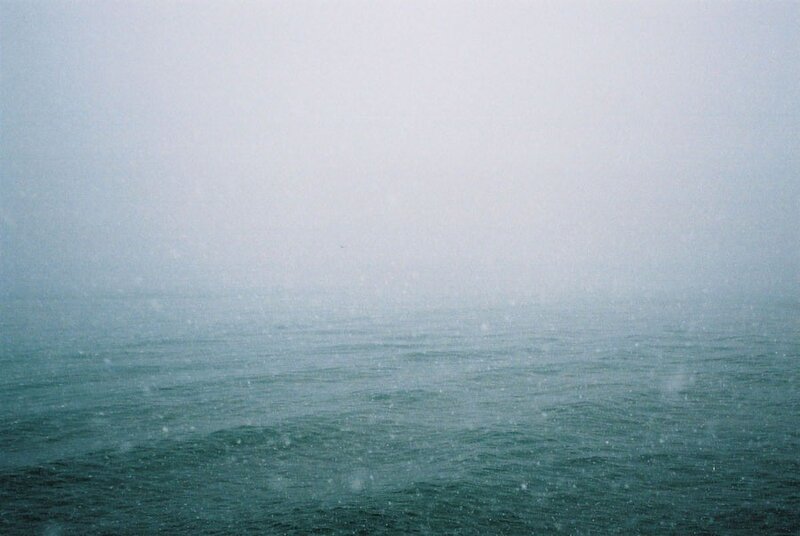 foggy sea during snowfall