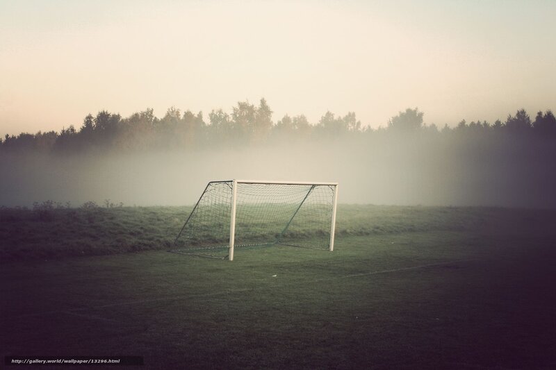 Foggy soccer goal at dawn