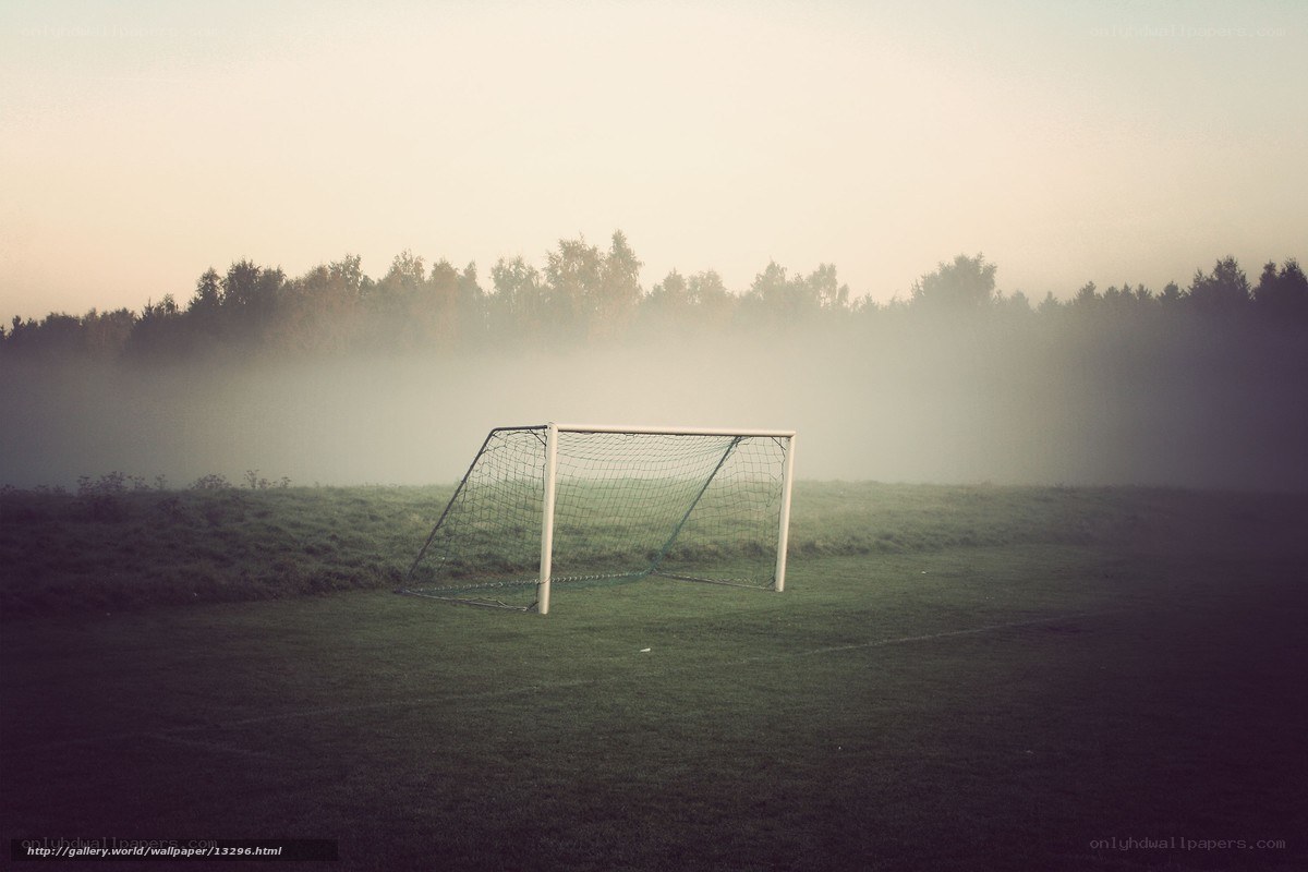 Foggy soccer goal at dawn