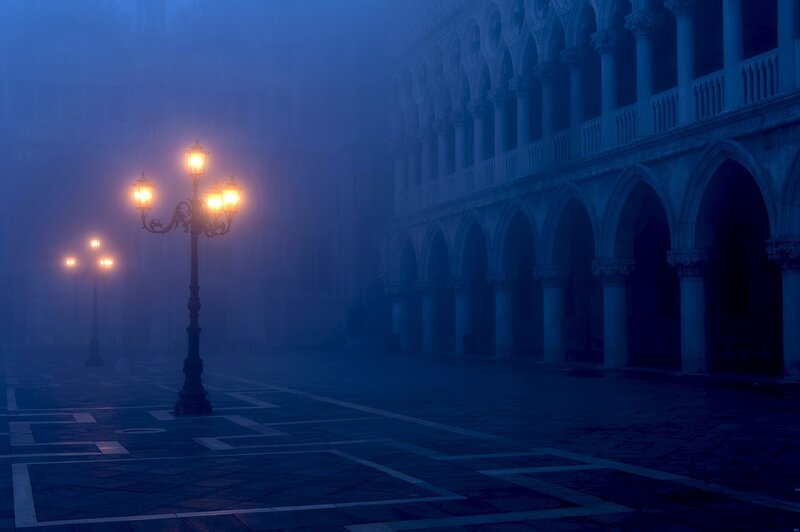 Foggy street lamps at night