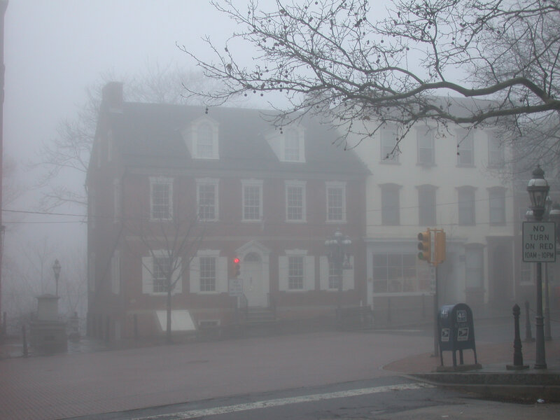 Foggy street with historic buildings