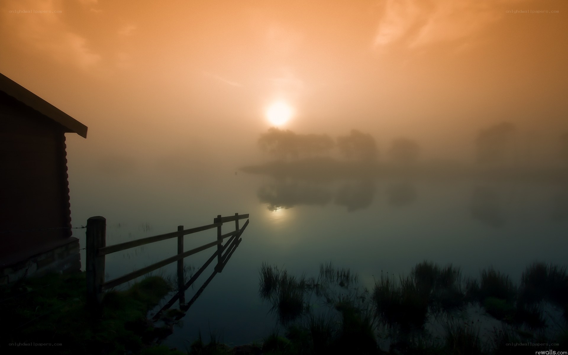 Foggy sunrise over a lake