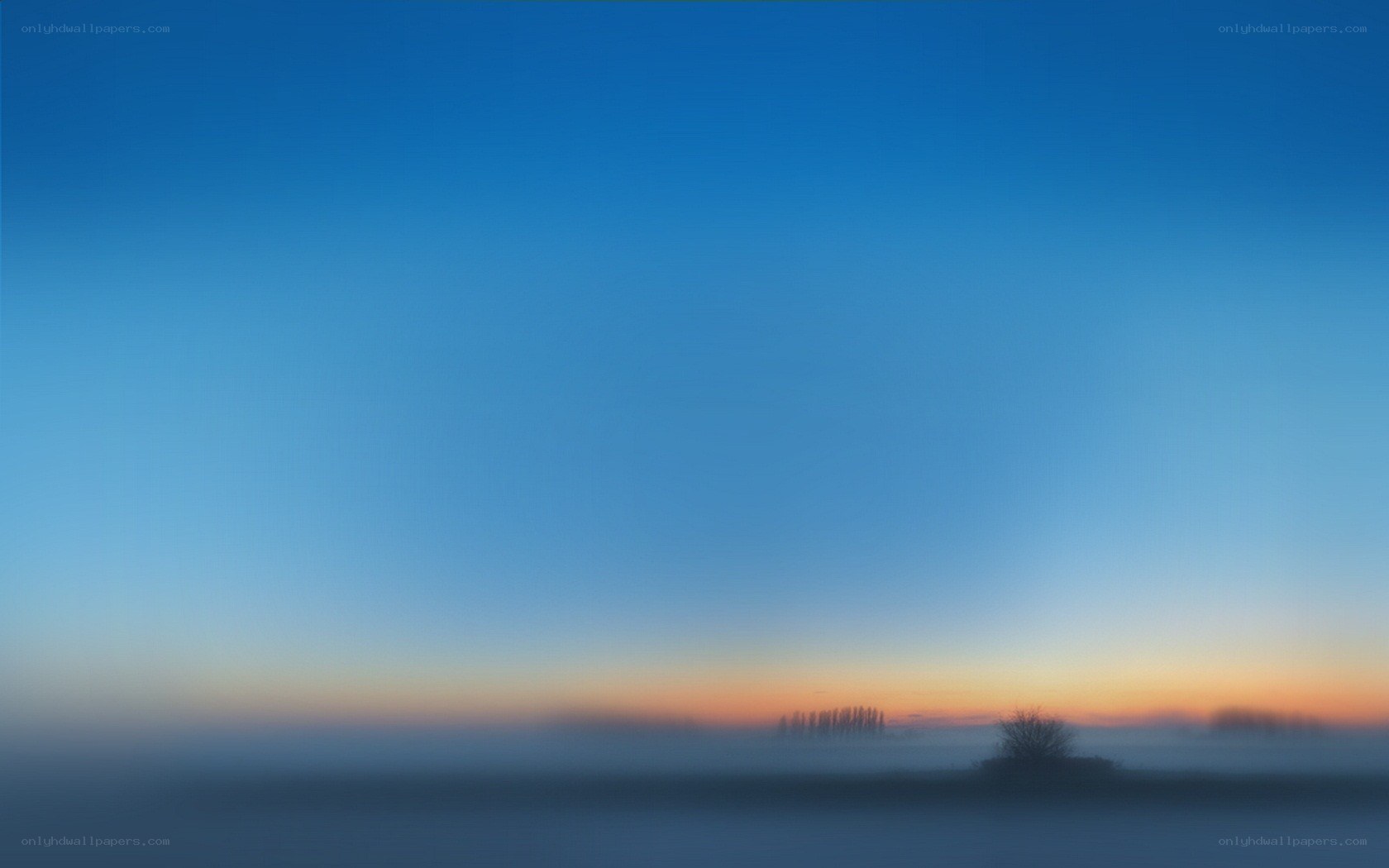 Foggy sunrise over a quiet landscape