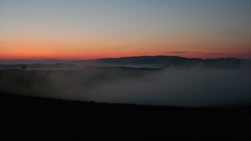 Foggy sunrise over mountains