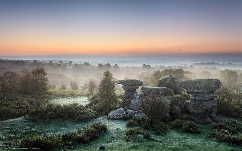 Foggy sunrise over rock formations