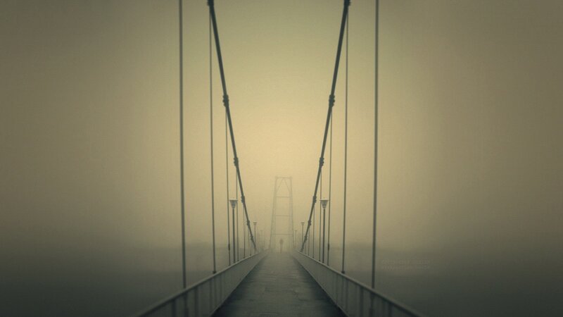 foggy suspension bridge