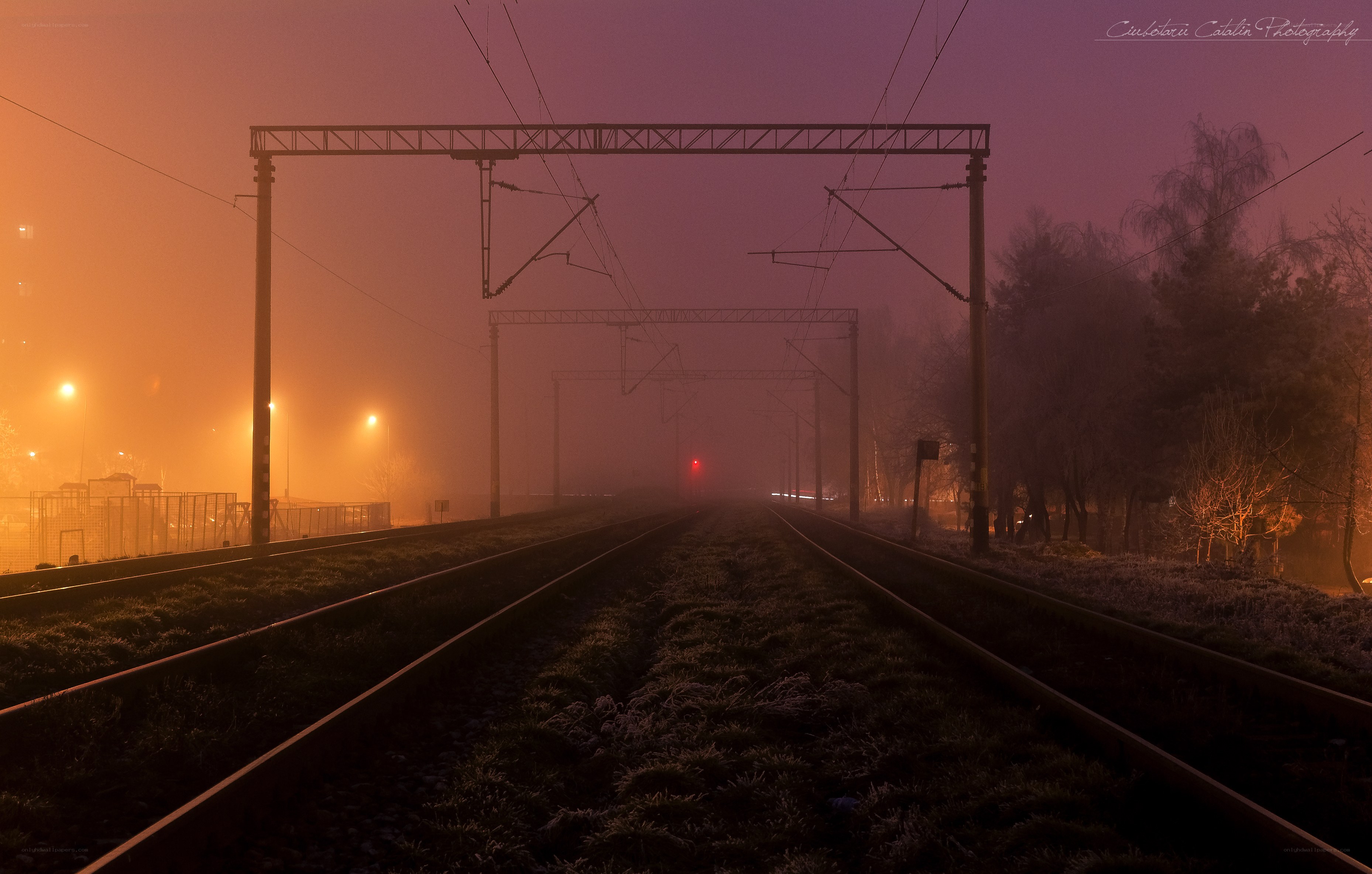 Foggy train tracks at dawn