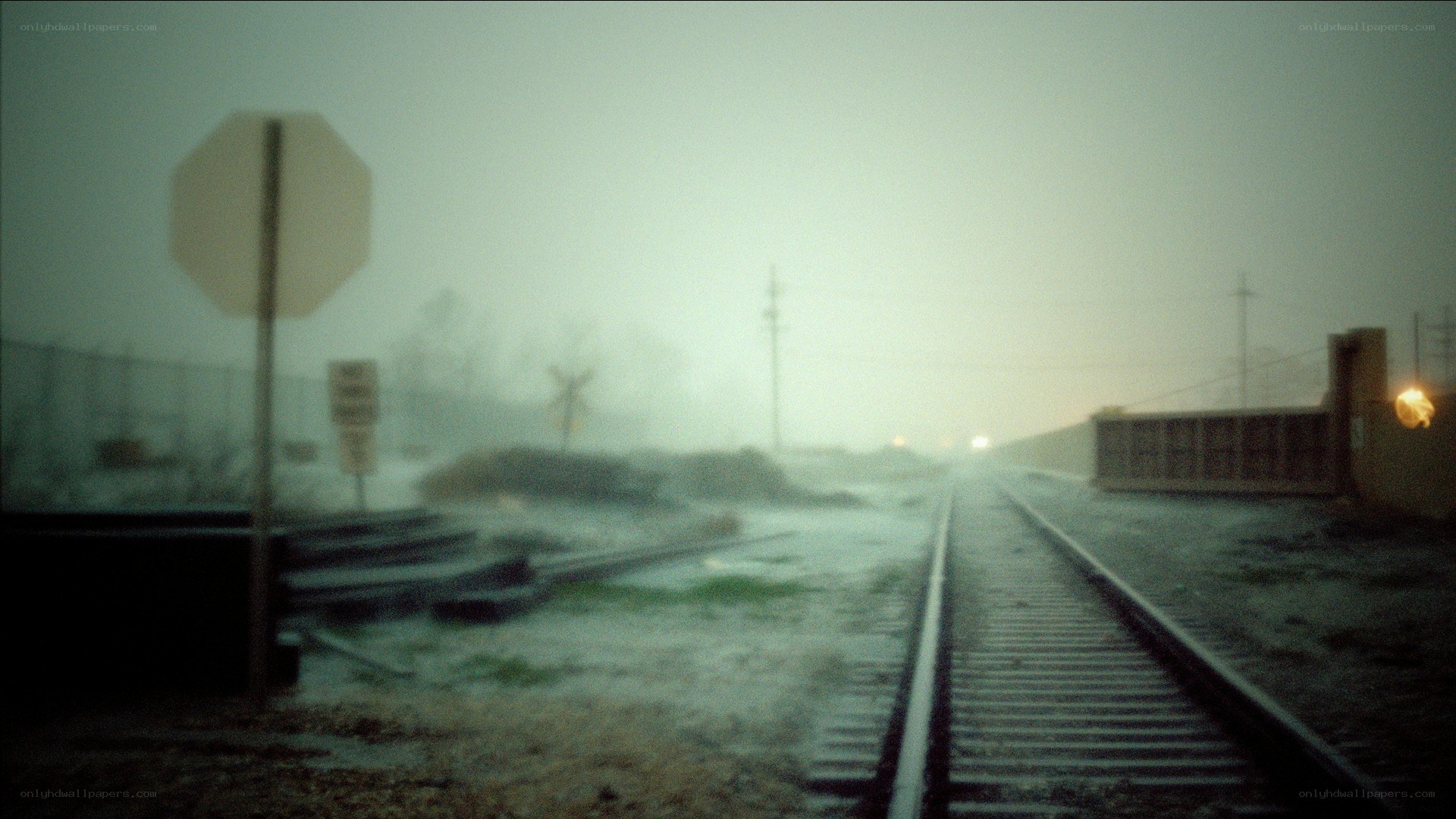 foggy train tracks at dusk