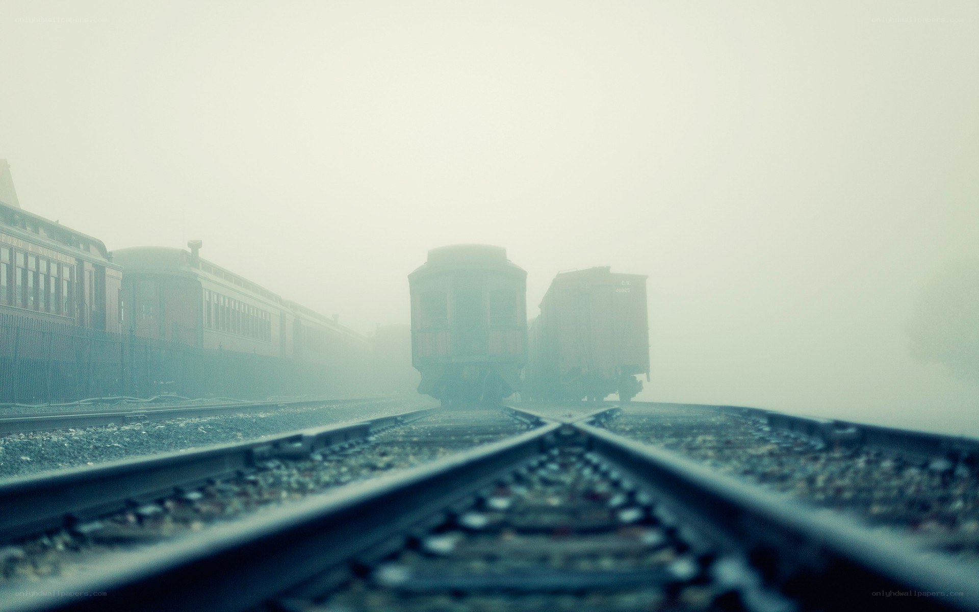 foggy train yard at dawn