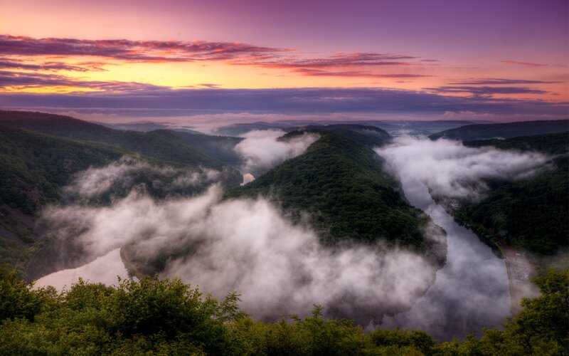 Foggy valley at sunset