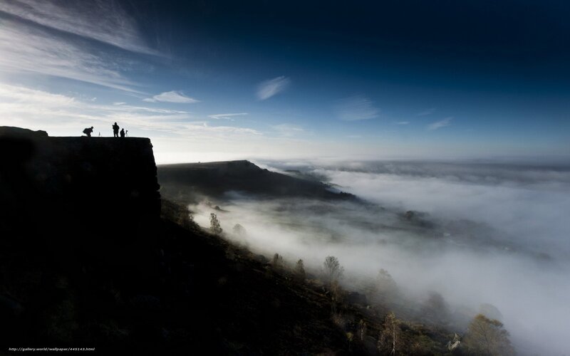 Foggy valley from cliff edge