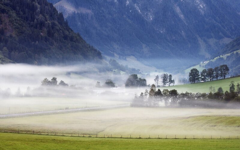 Foggy valley with mountains