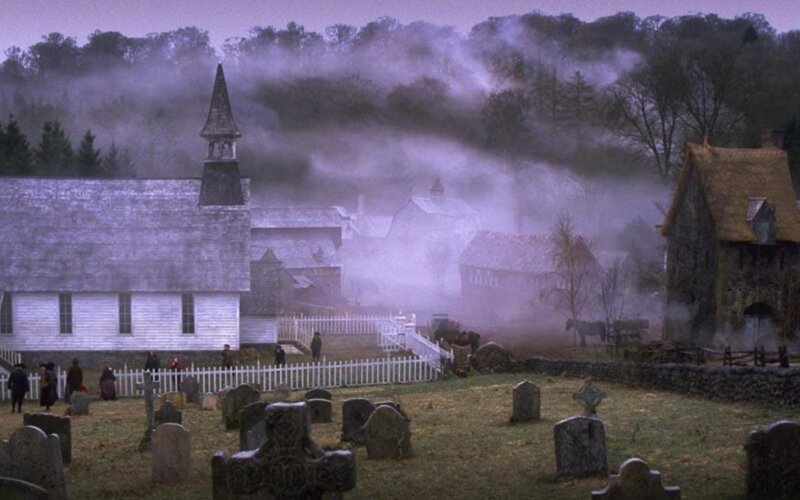 foggy village with church