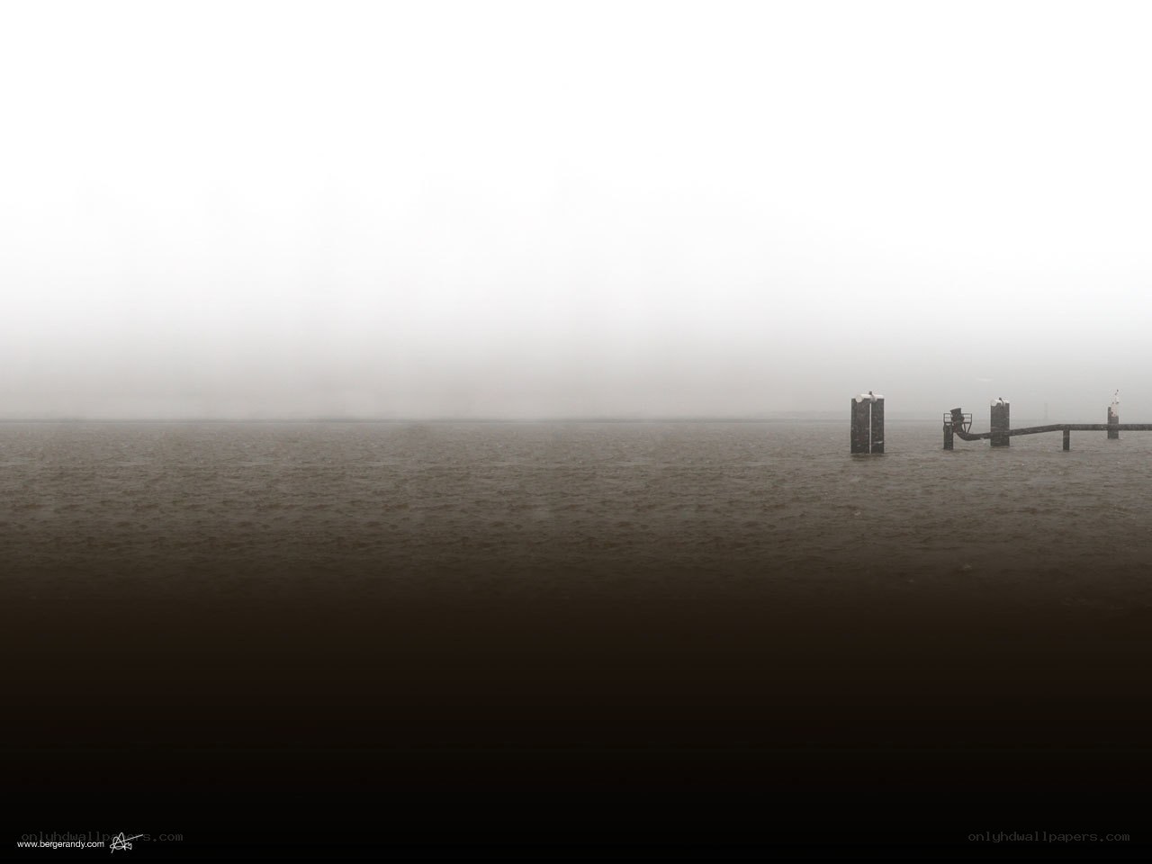 foggy water with pier