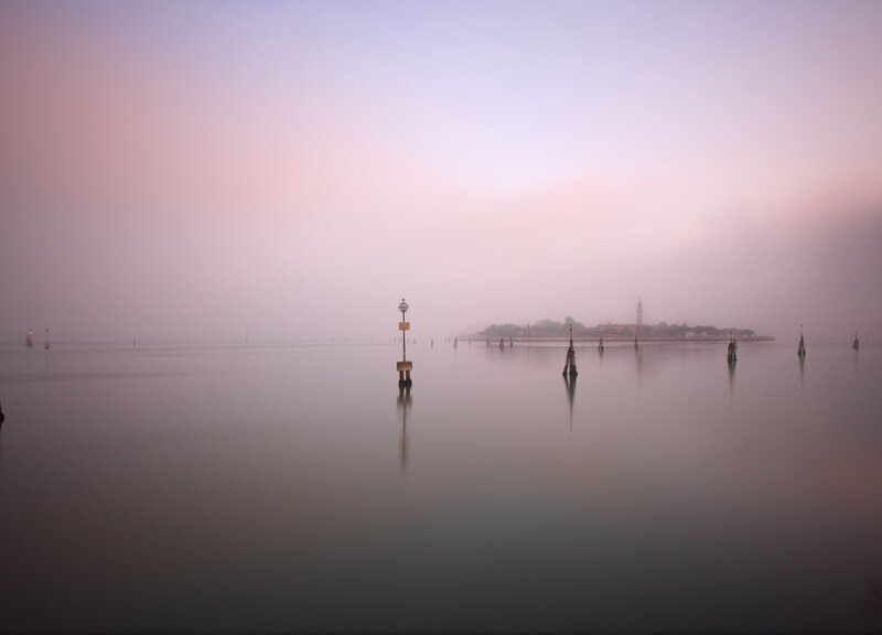 Foggy Water with Posts