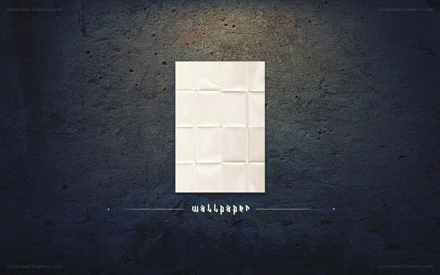 folded paper on concrete wall