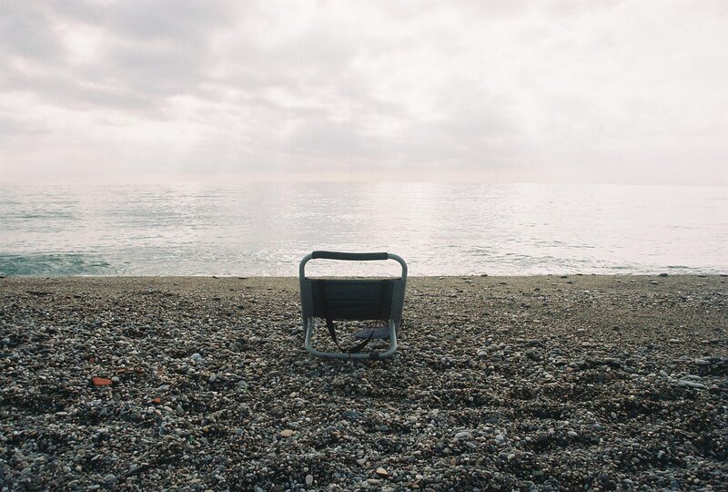 Folding Chair on Beach — Gray