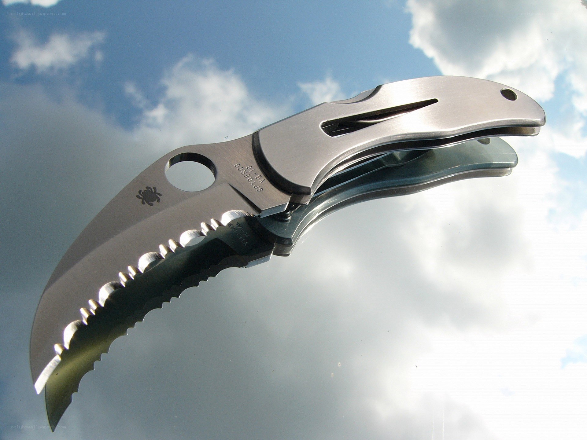 folding knife against sky