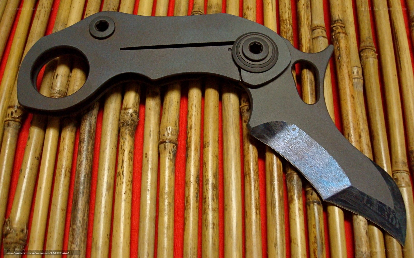 folding knife on bamboo mat