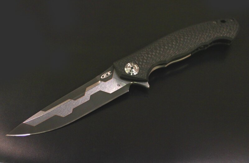 Folding Knife on Black Surface