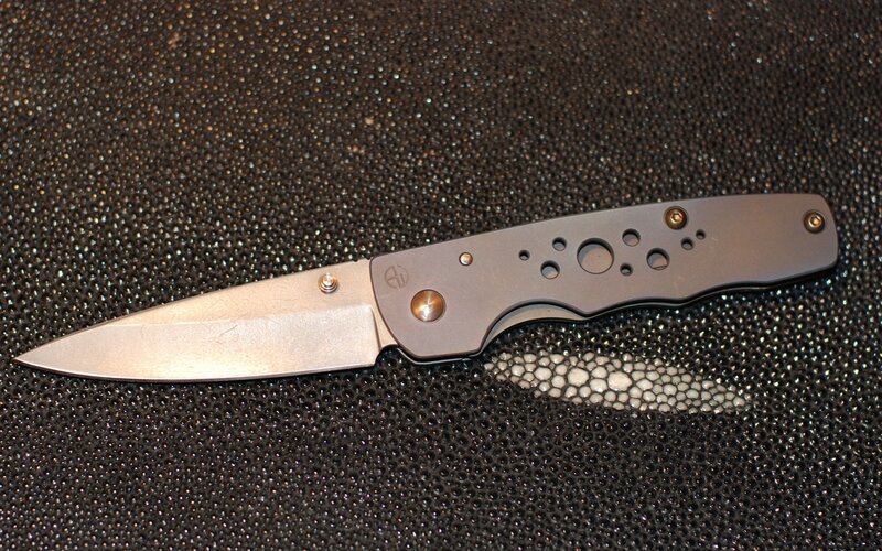 Folding Knife on Textured Surface — Black, Neutral