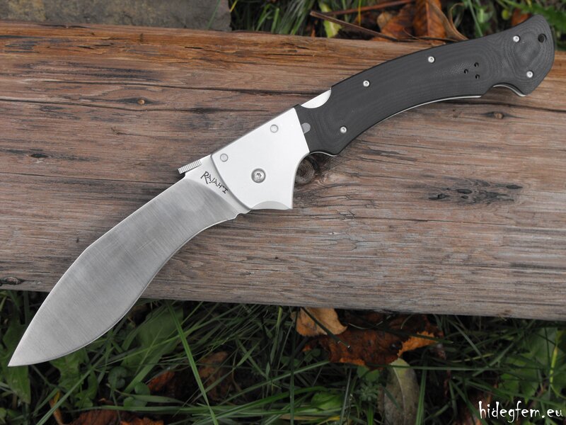 Folding Knife on Wood — Brown