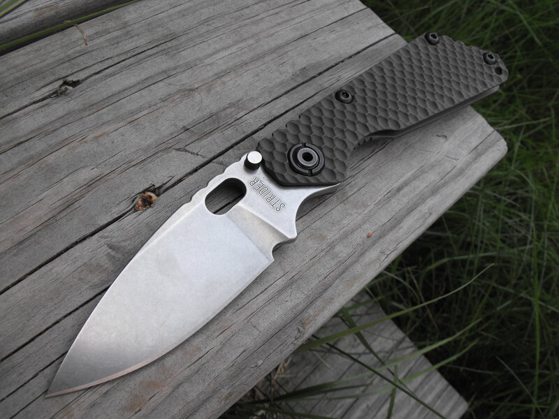 folding knife on wooden surface