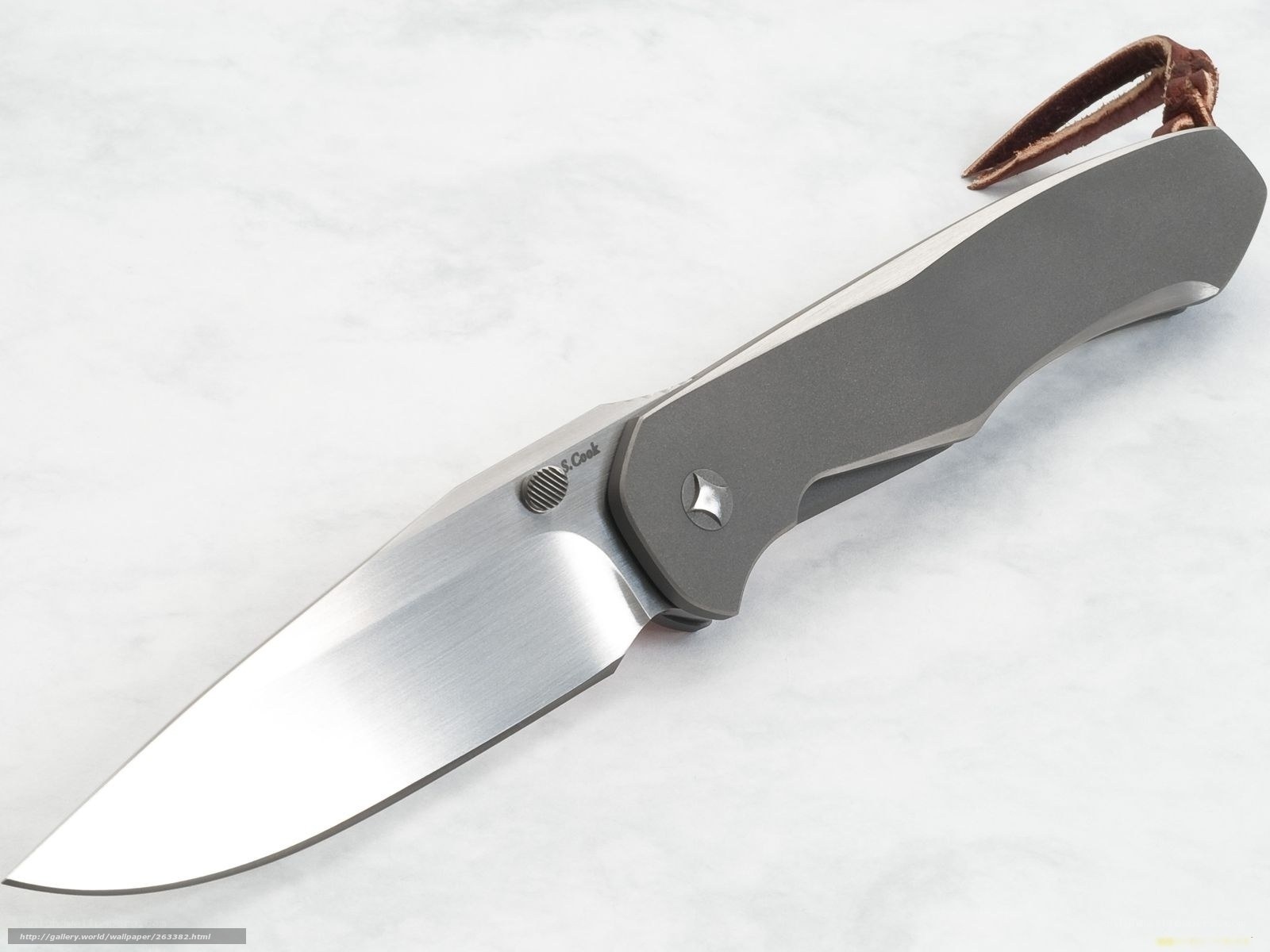 folding knife with leather lanyard