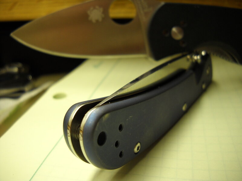 folding knives on paper