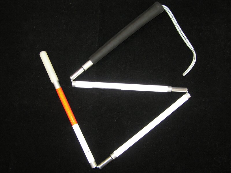 folding white cane with orange tip
