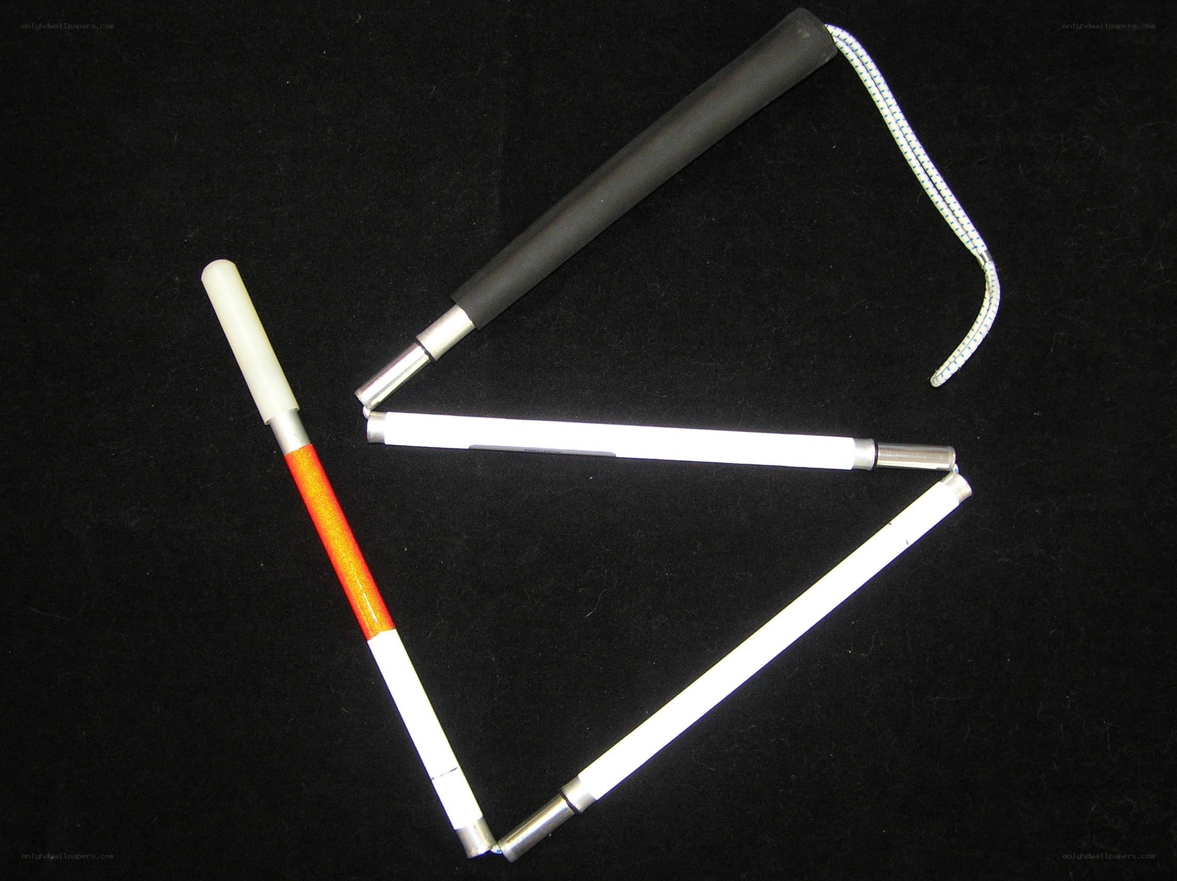 folding white cane with orange tip