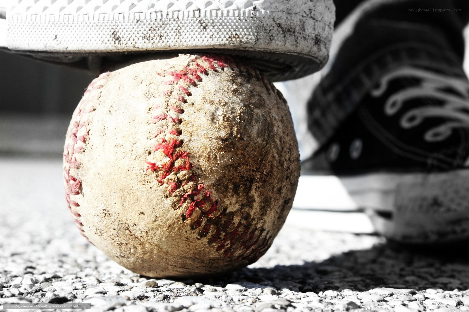 foot crushing a baseball