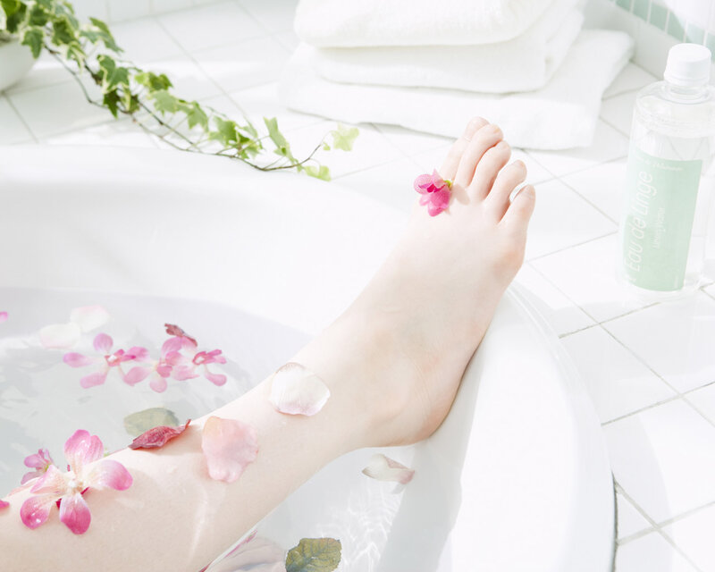 Foot in Bathtub with Flowers — White