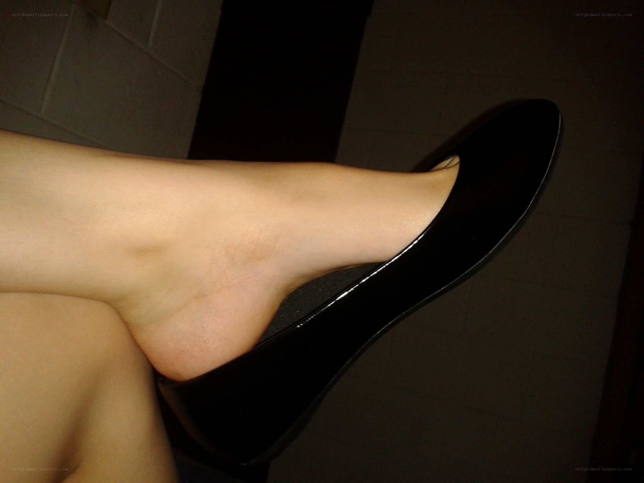 foot in black shoe