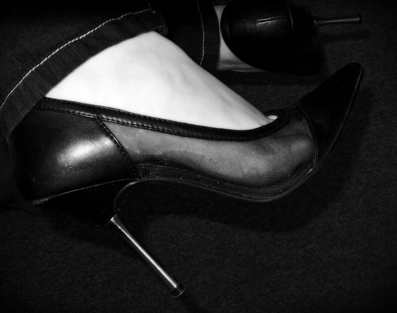 Foot in High-heeled Shoe — Black, Dramatic