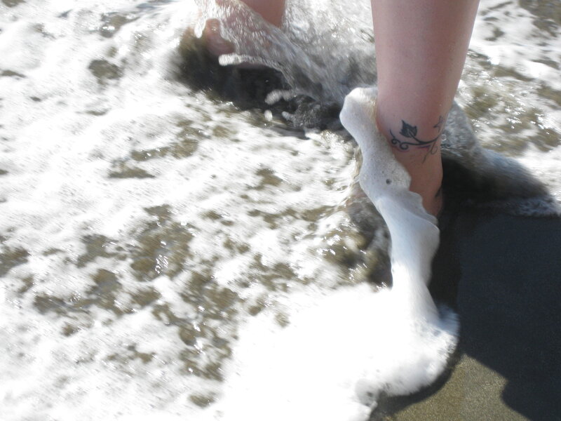 foot in ocean wave