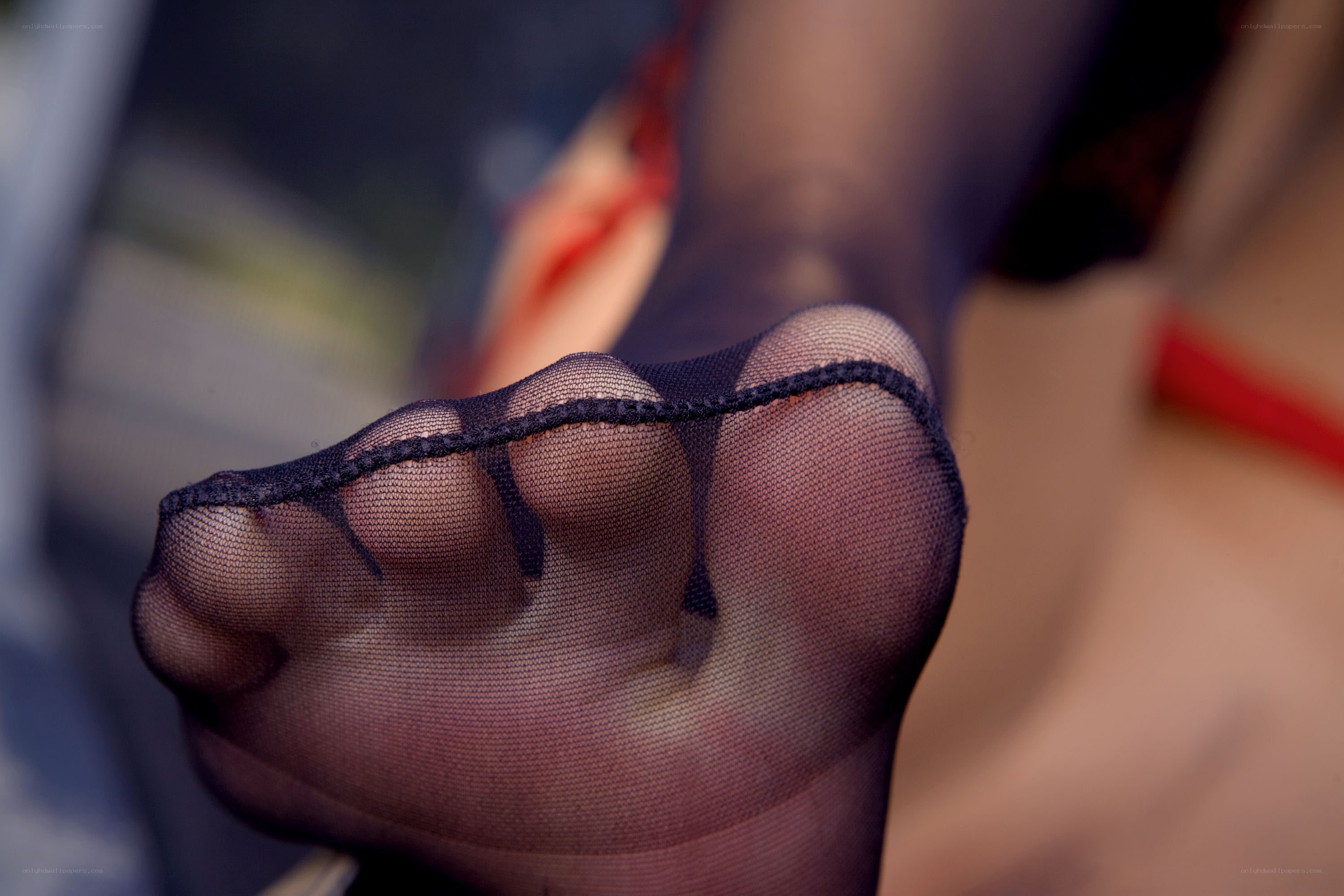 foot in sheer black stocking