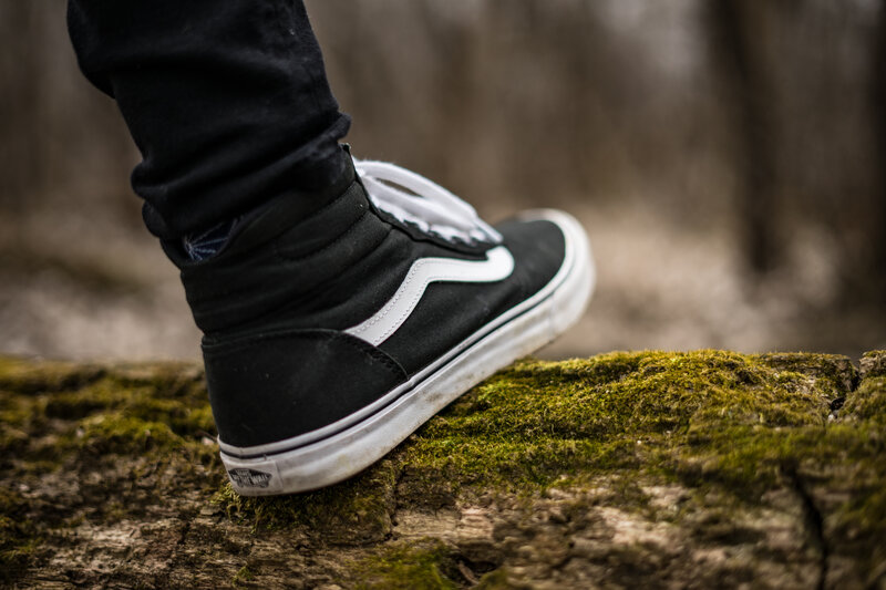 foot on mossy log