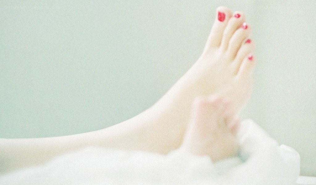 foot with red nail polish