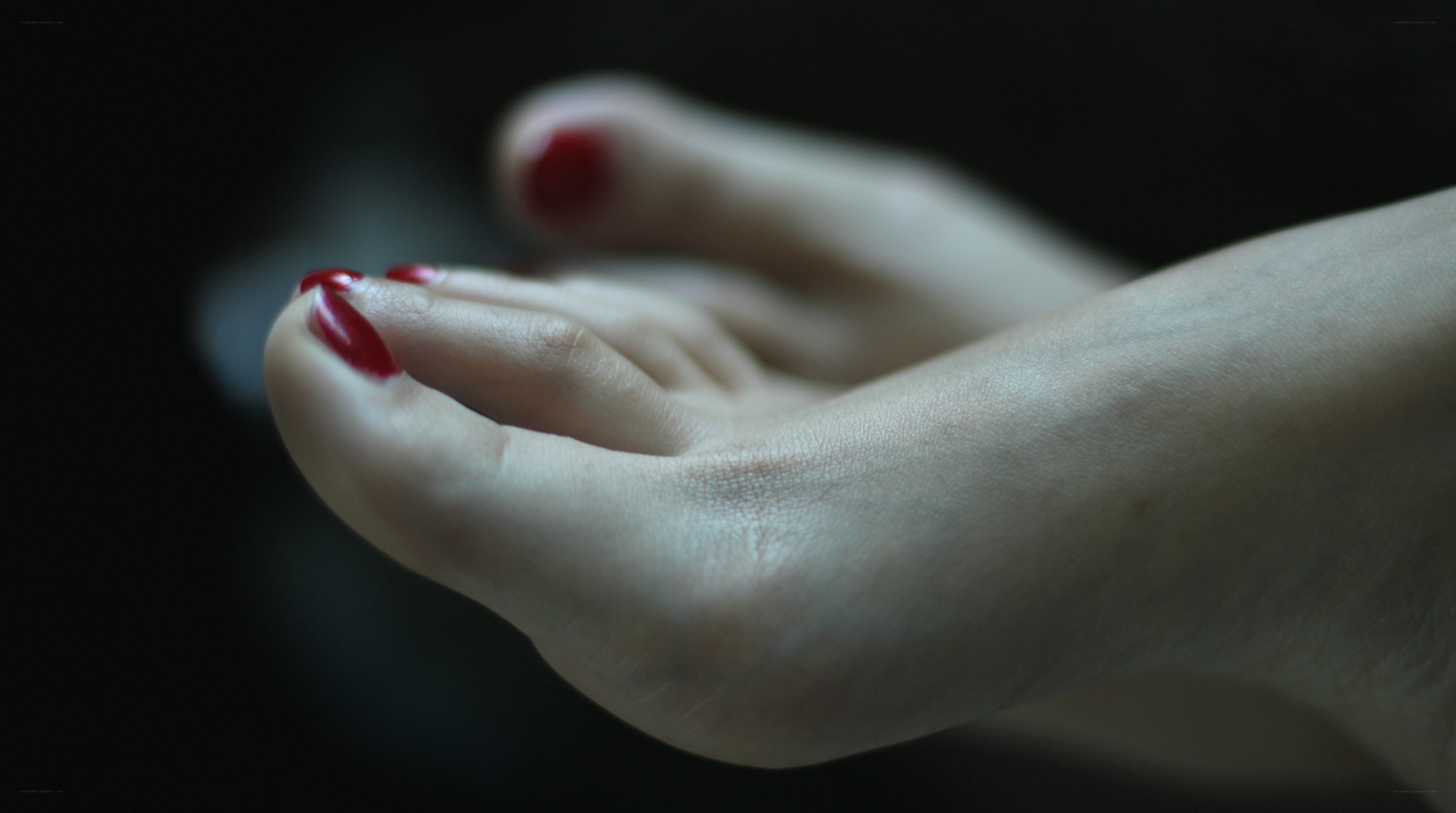 foot with red nail polish