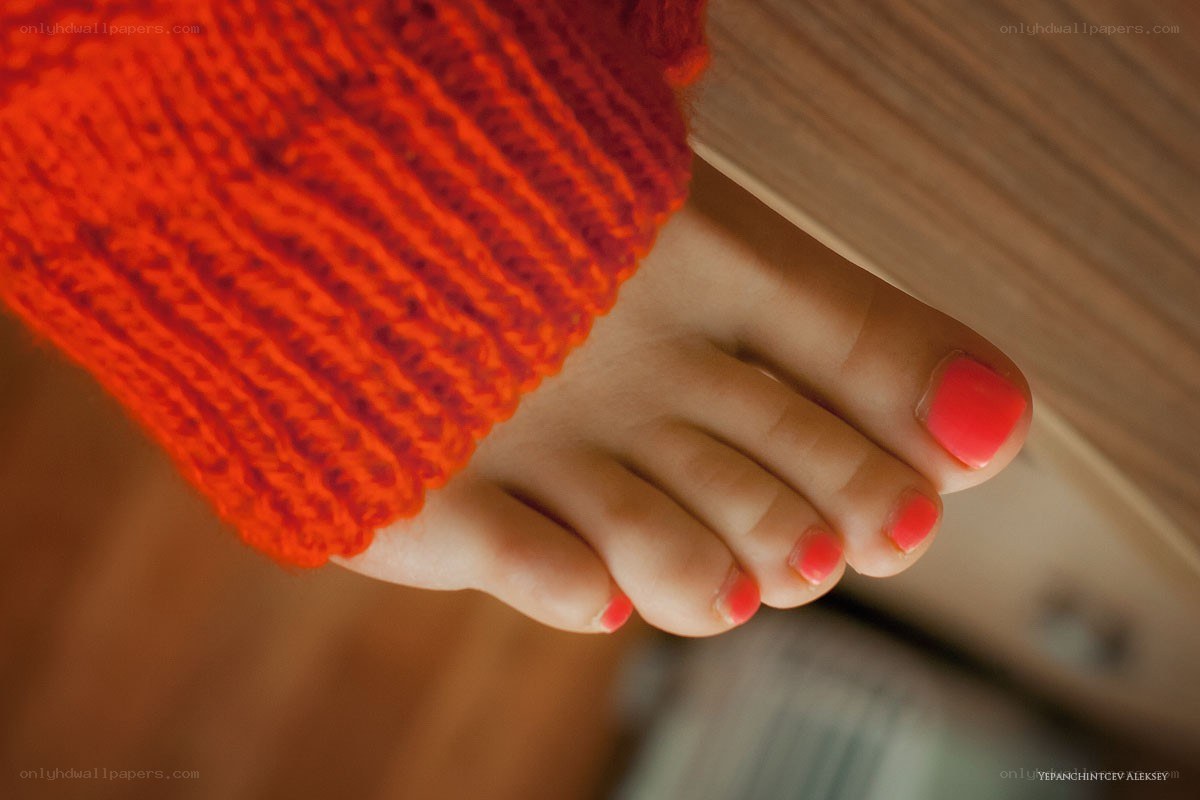 foot with red nail polish