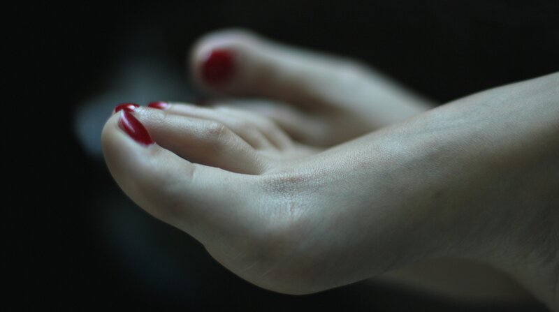 Foot with Red Nail Polish — Dramatic