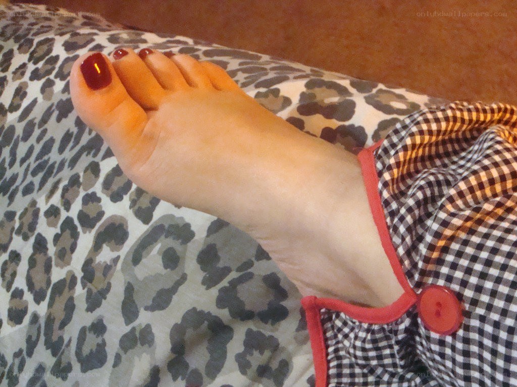 foot with red nail polish