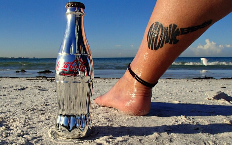 Foot with Tattoo on Beach